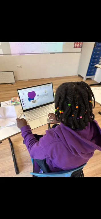 Student working independently on a laptop during Golden Hour project time at TISA Lisbon