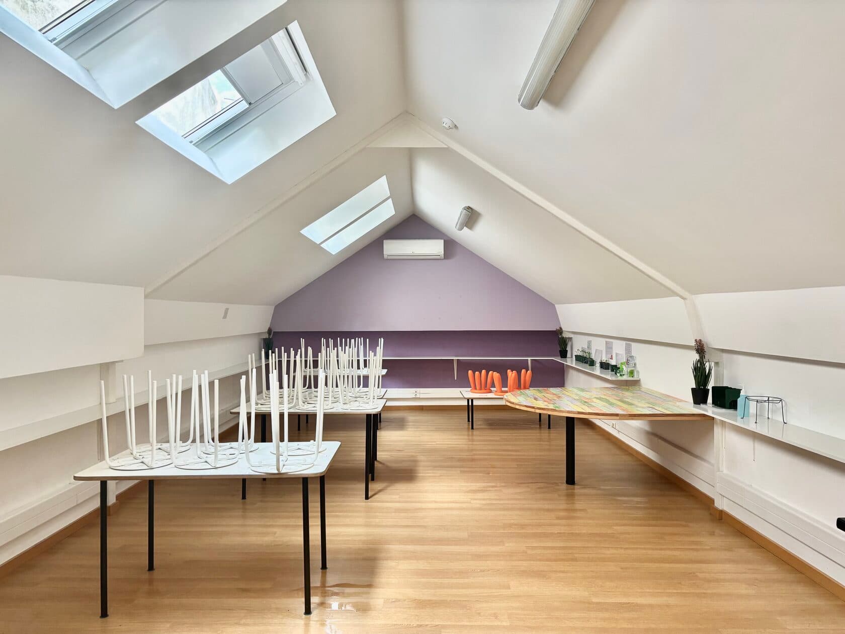 Bright TISA Lisbon corridor with glass-walled classrooms