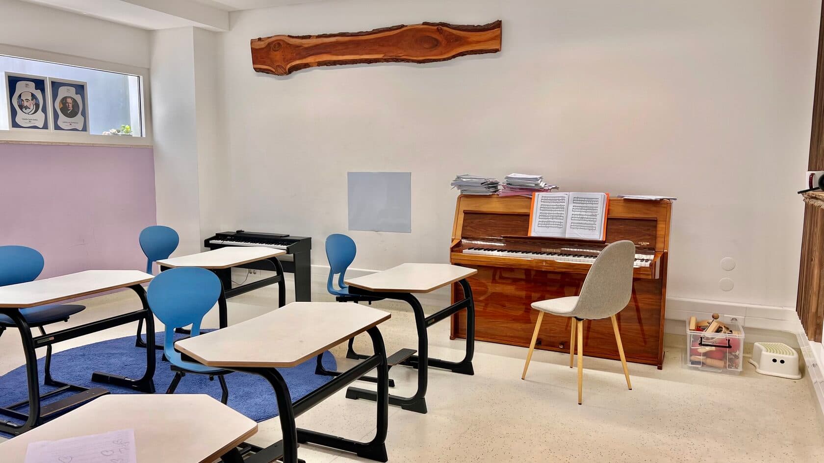 TISA Lisbon music room with an upright piano and blue chairs